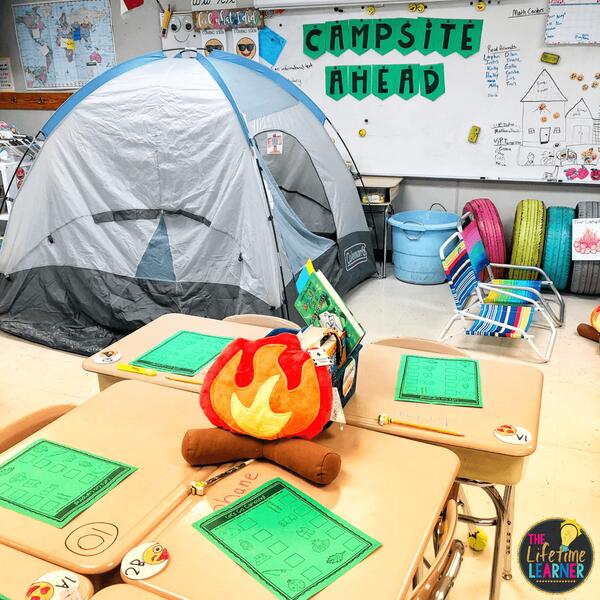 camping classroom transformation tent with campfire and sign on board that says campsite ahead